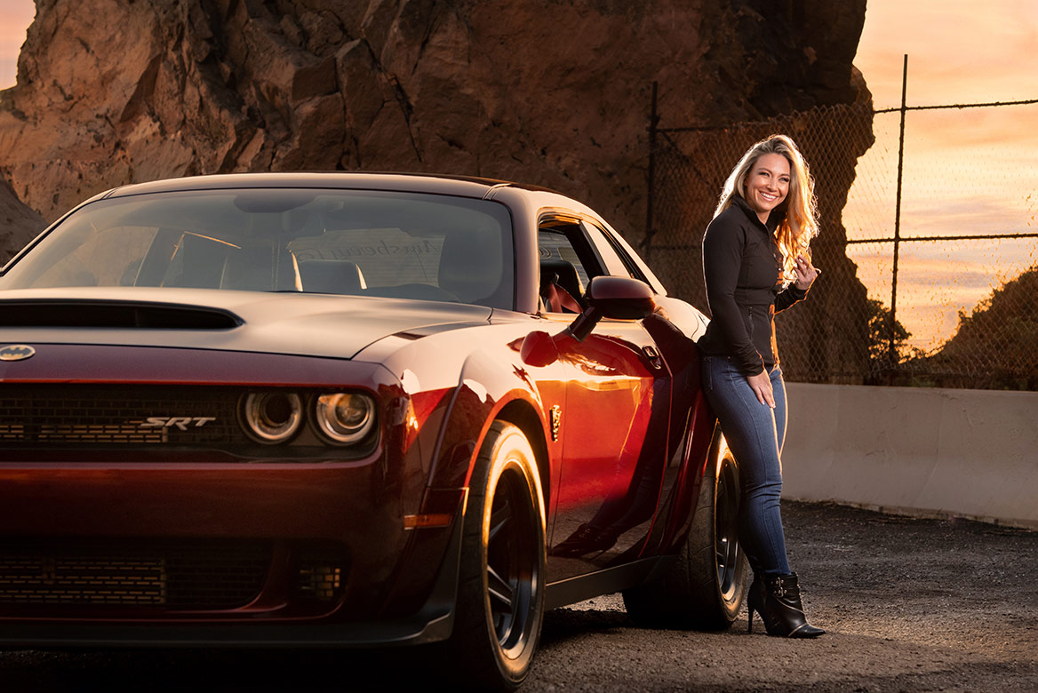Woman with a dodge challenger