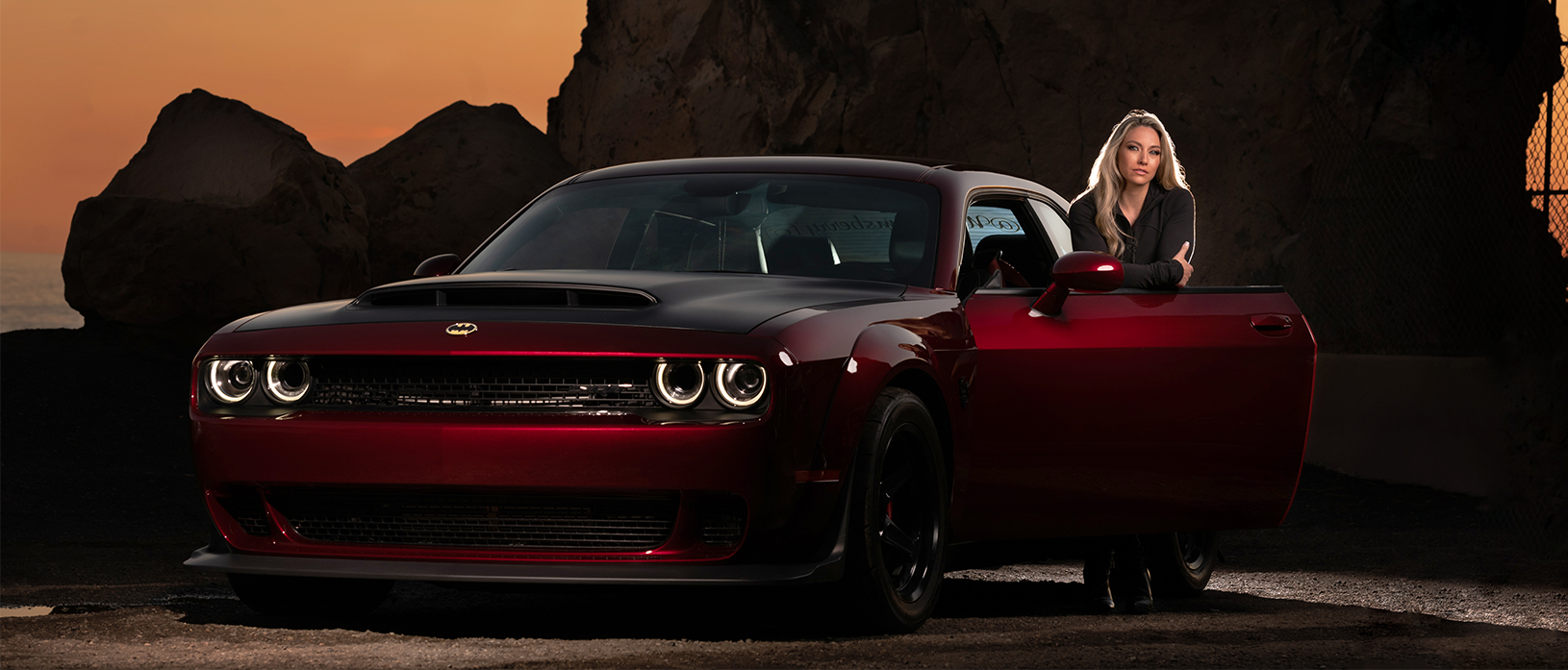 woman with dodge challenger