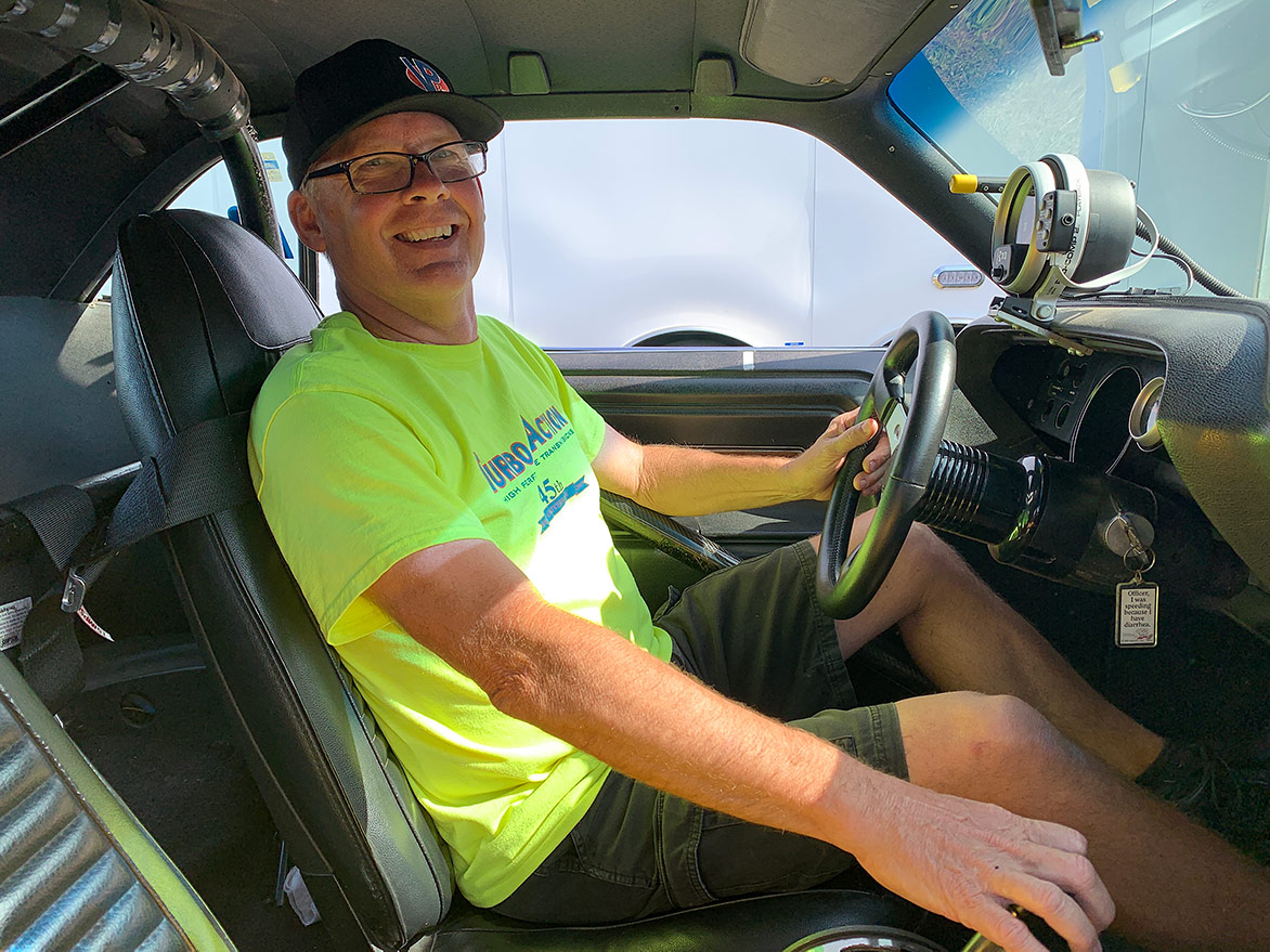 Man in the driver's seat of a vehicle