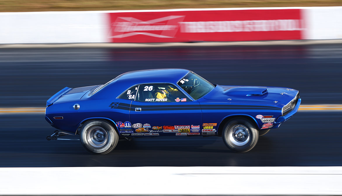 vehicle racing down a drag strip