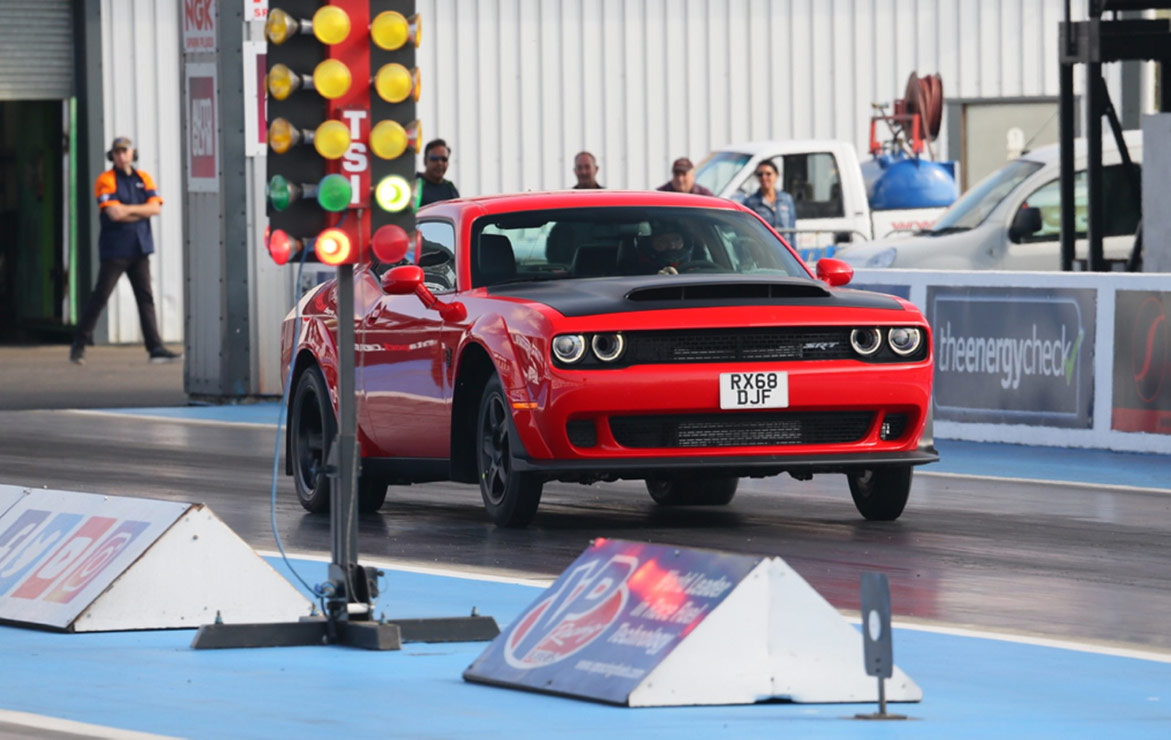 Dodge vehicle on the starting line of a drag strip