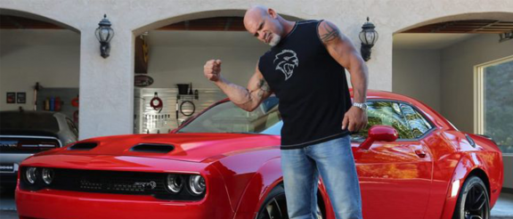 Bill Goldberg with a dodge vehicle