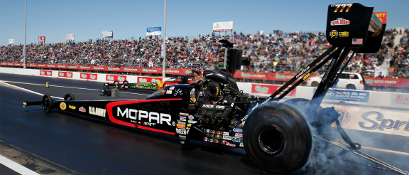 top fuel dragster on the starting line of a drag strip