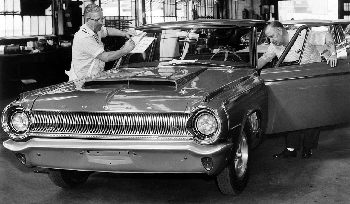 two men working on a vehicle