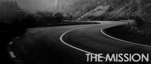 Empty Road with mountains on one side