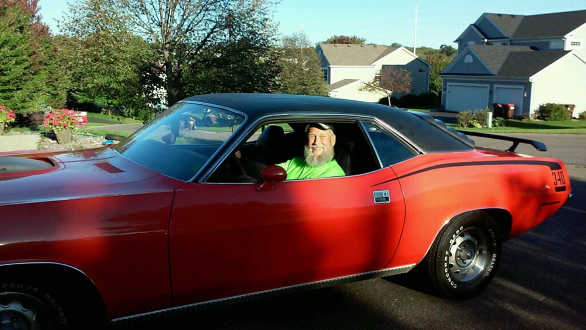 man in the driver's seat of a vehicle