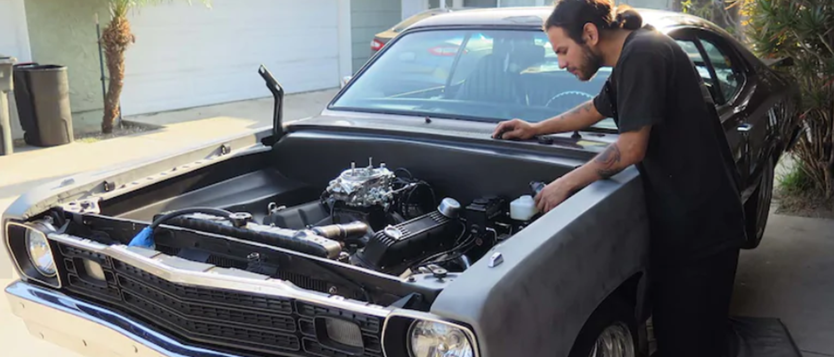 man working on a vehicle