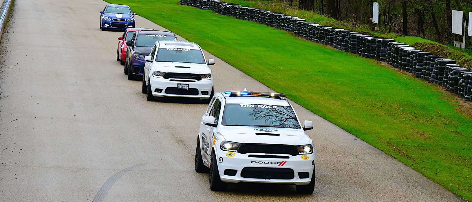 vehicles driving on a track