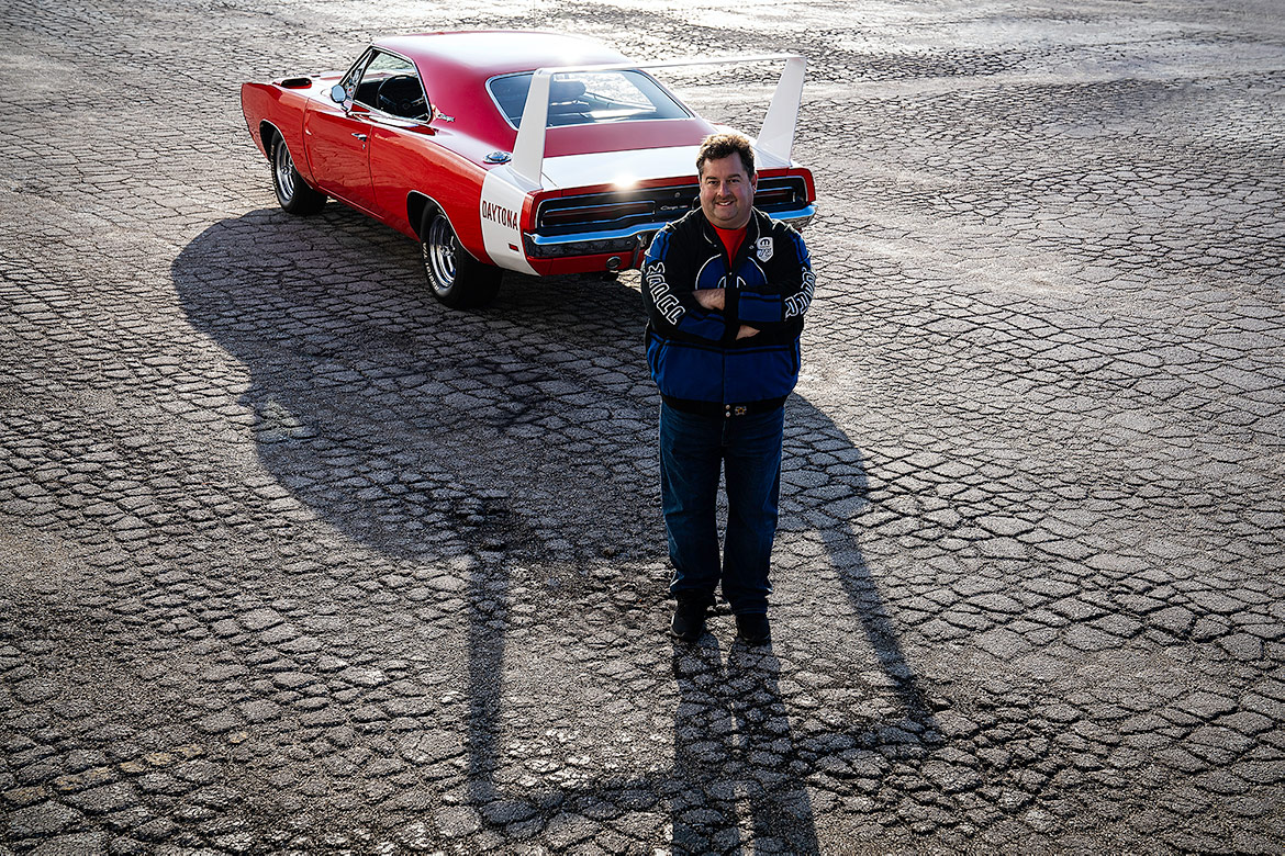 man standing with a vehicle