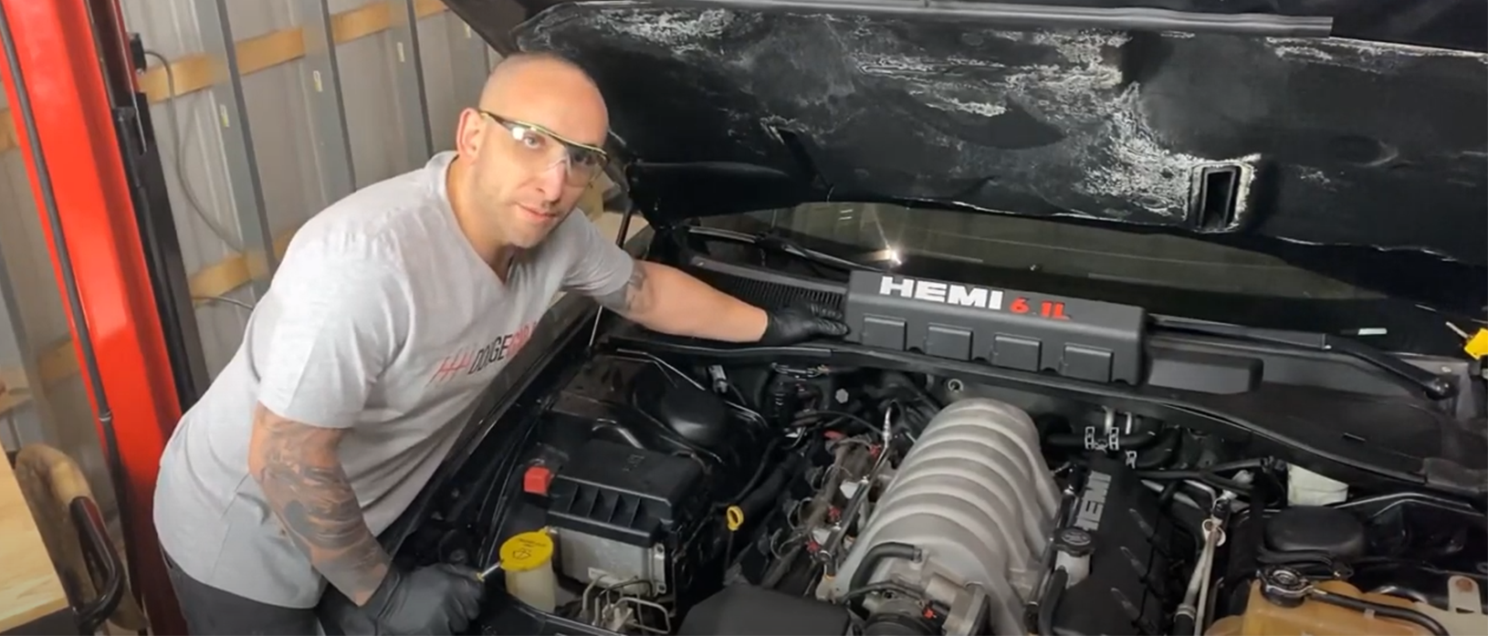 Man working on a vehicle engine