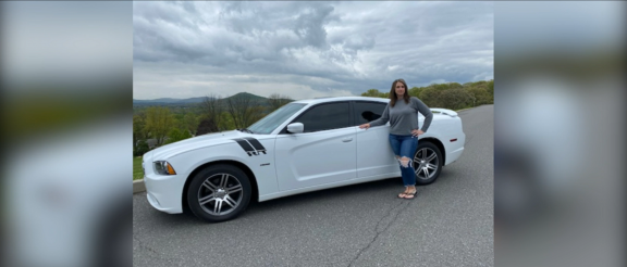 rhonda in front of her dodge charger r/t