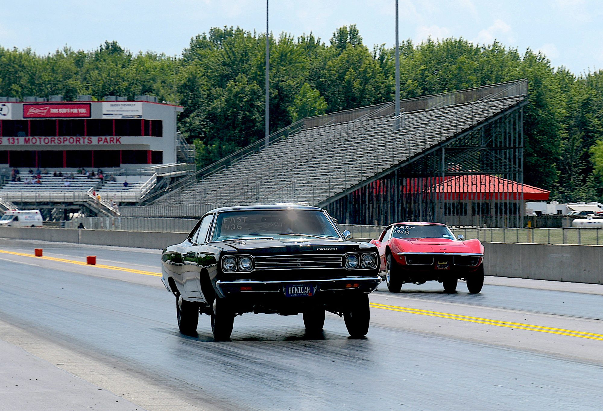 two vehicles drag racing