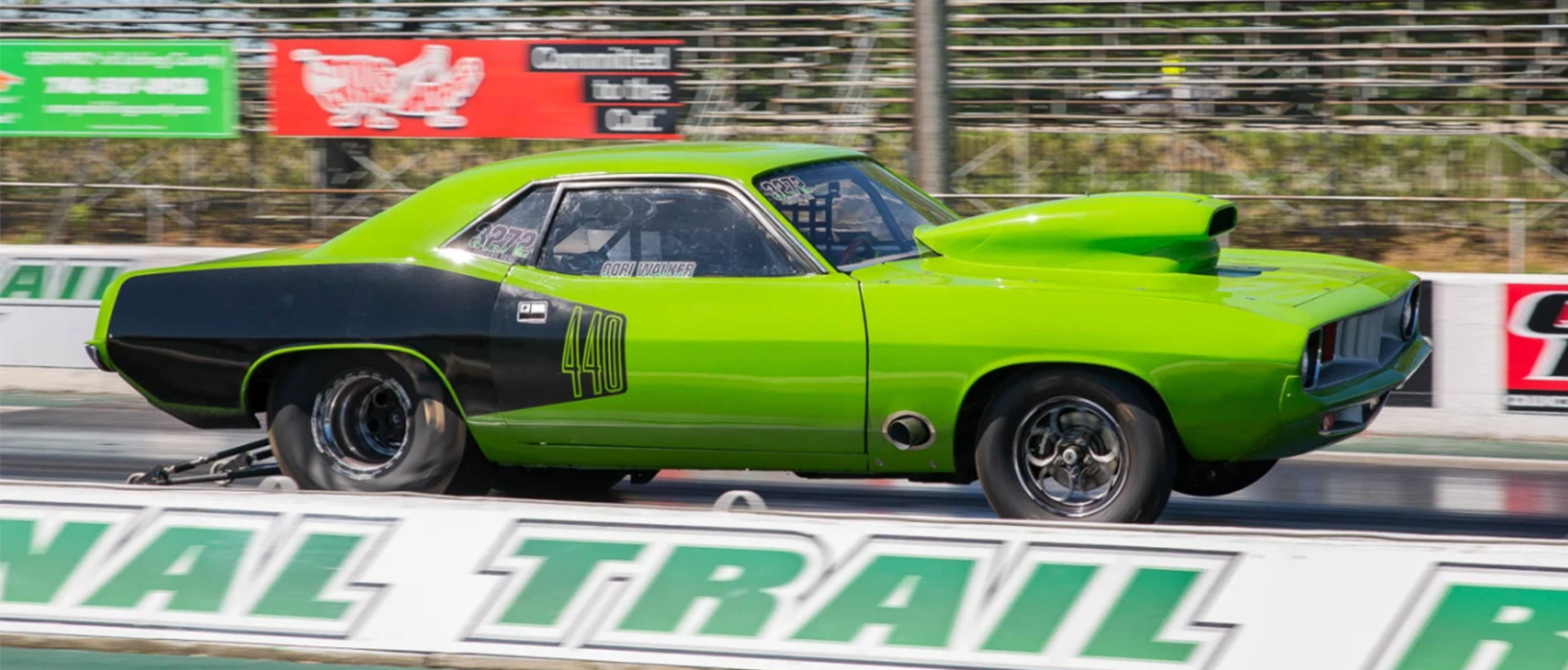 1972 plymouth barracuda on the starting line of a drag strip