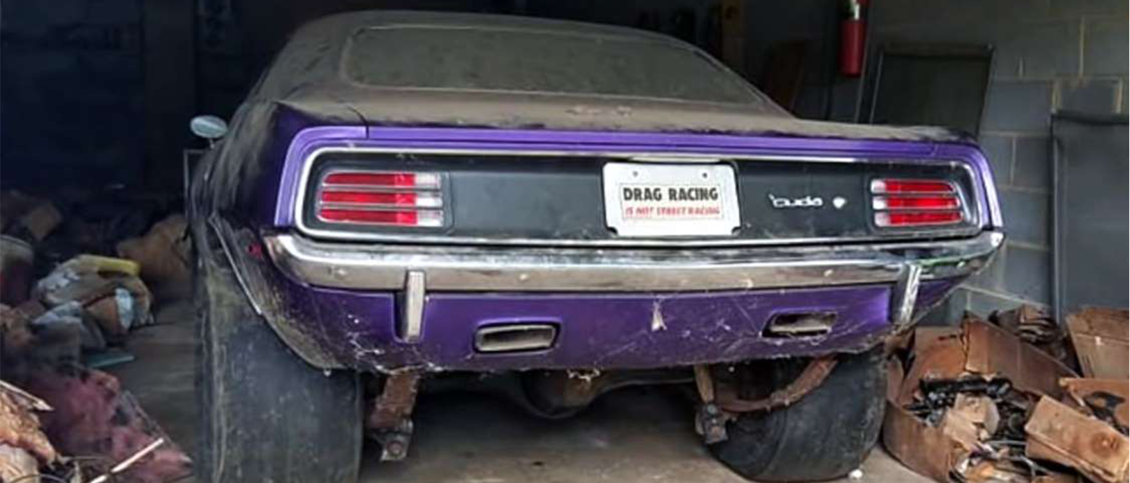 1970 plymouth cuda in a garage