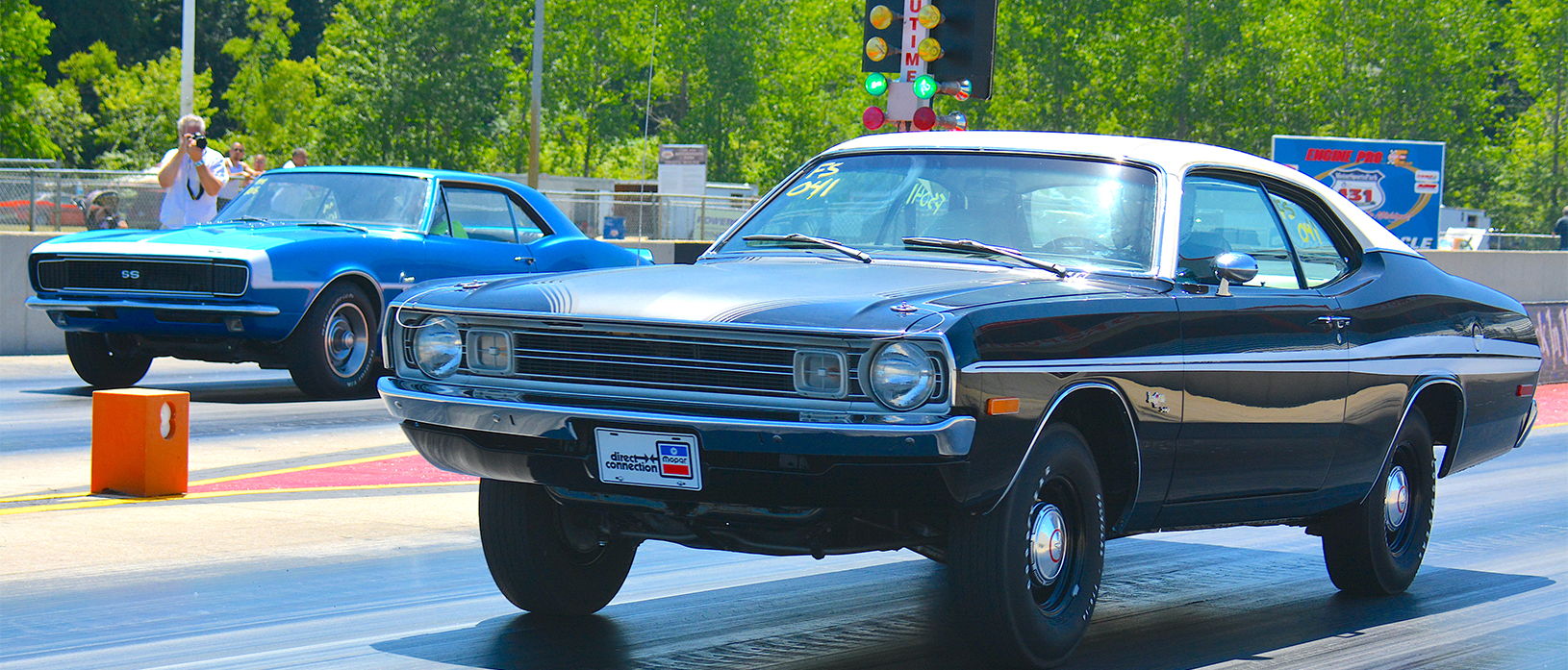 two vehicles on a drag strip