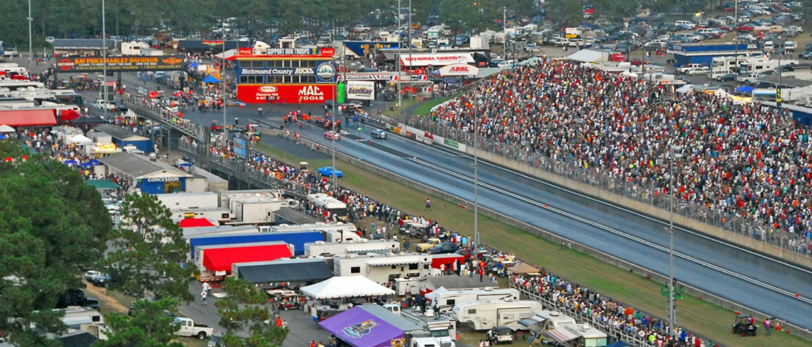 filled grandstands at a drag strip