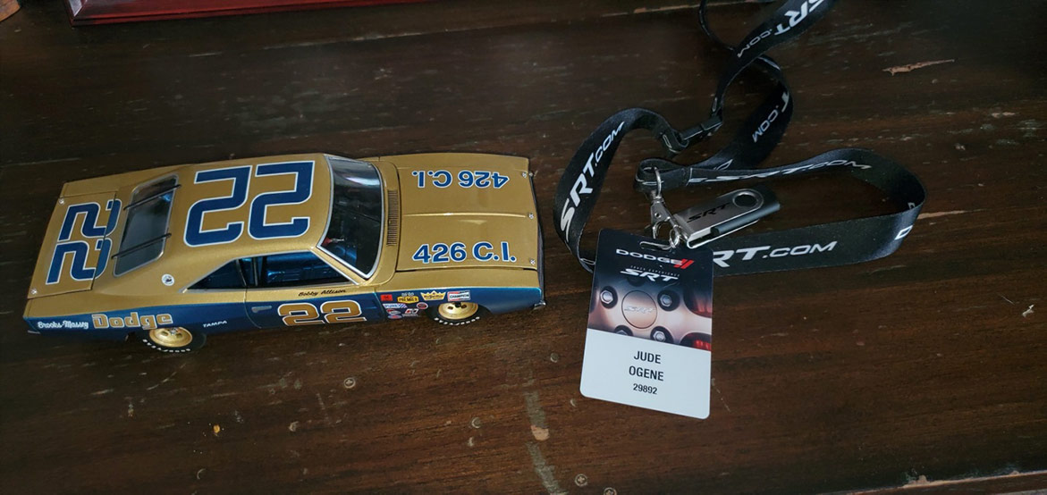 model car and a badge attached to a lanyard