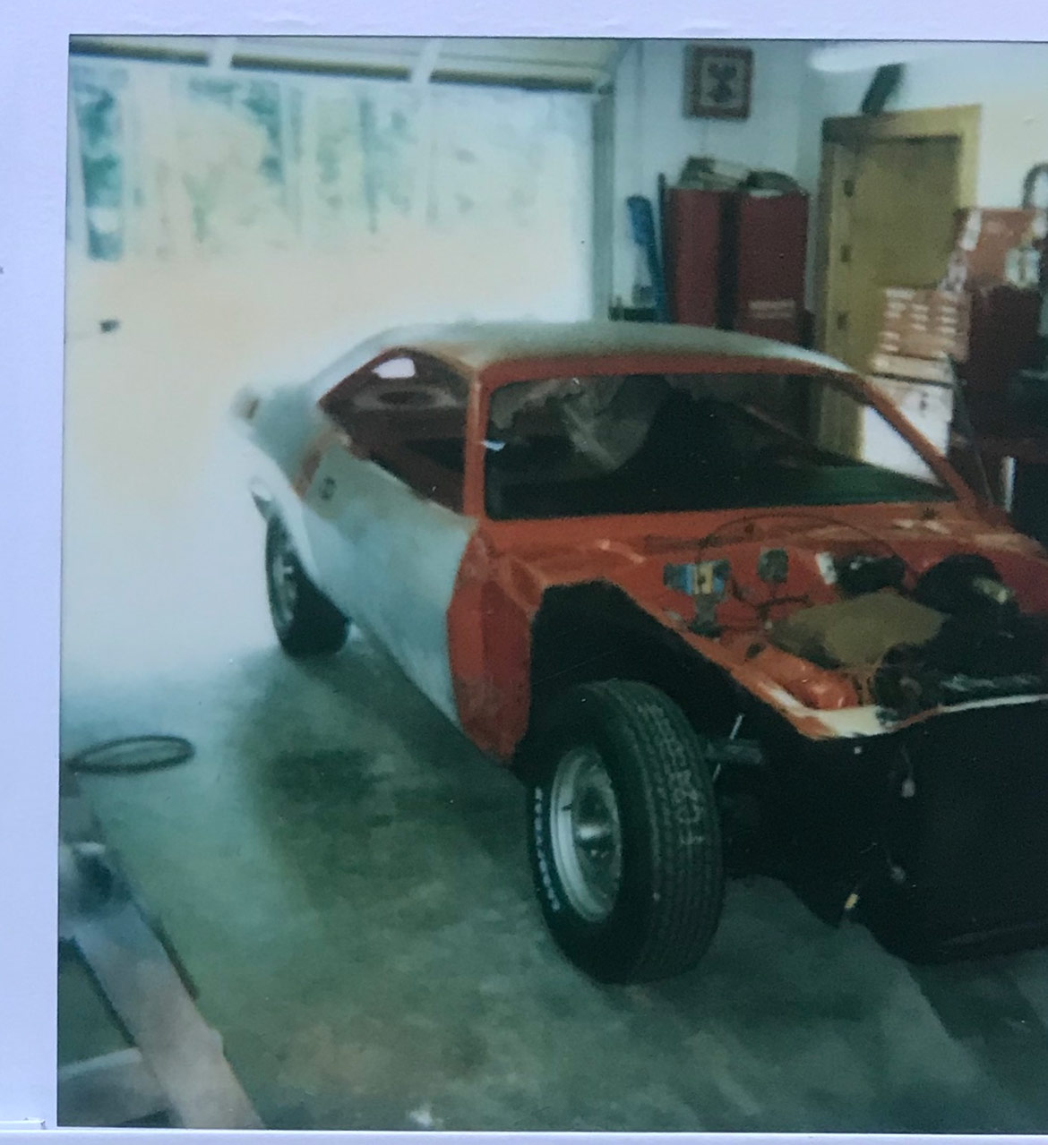 vehicle being worked on in a garage