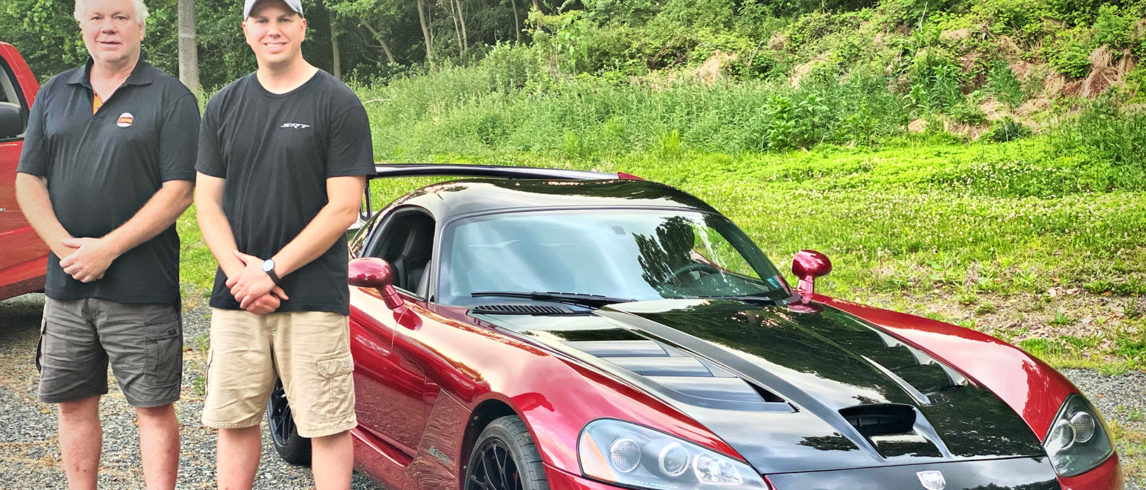 Two men with a Dodge Viper