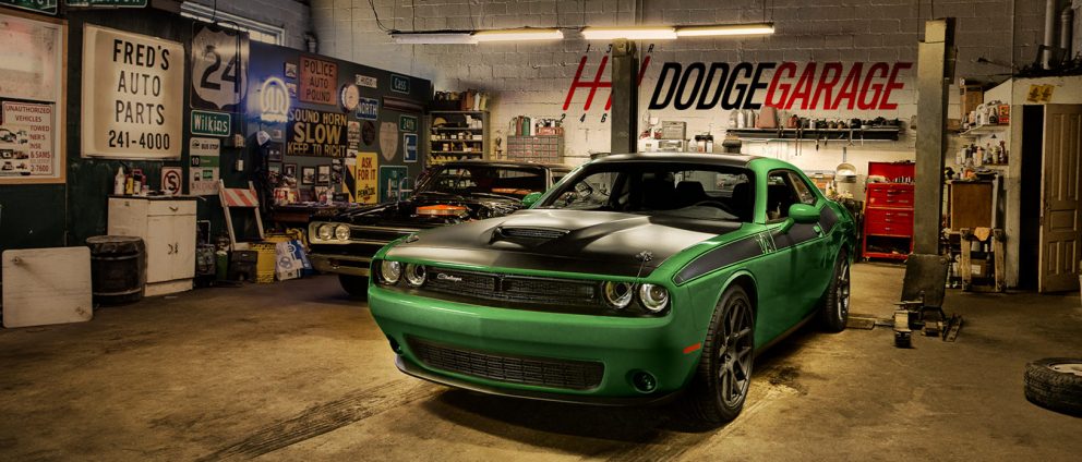 Green Challenger inside of a garage