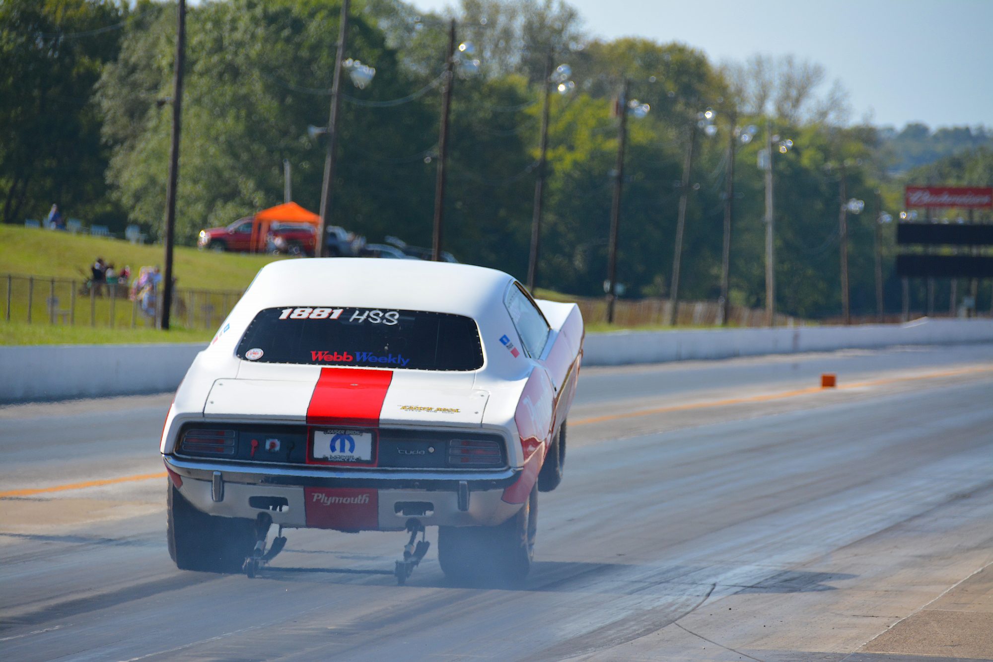 Dodge pulling a wheelie down the track