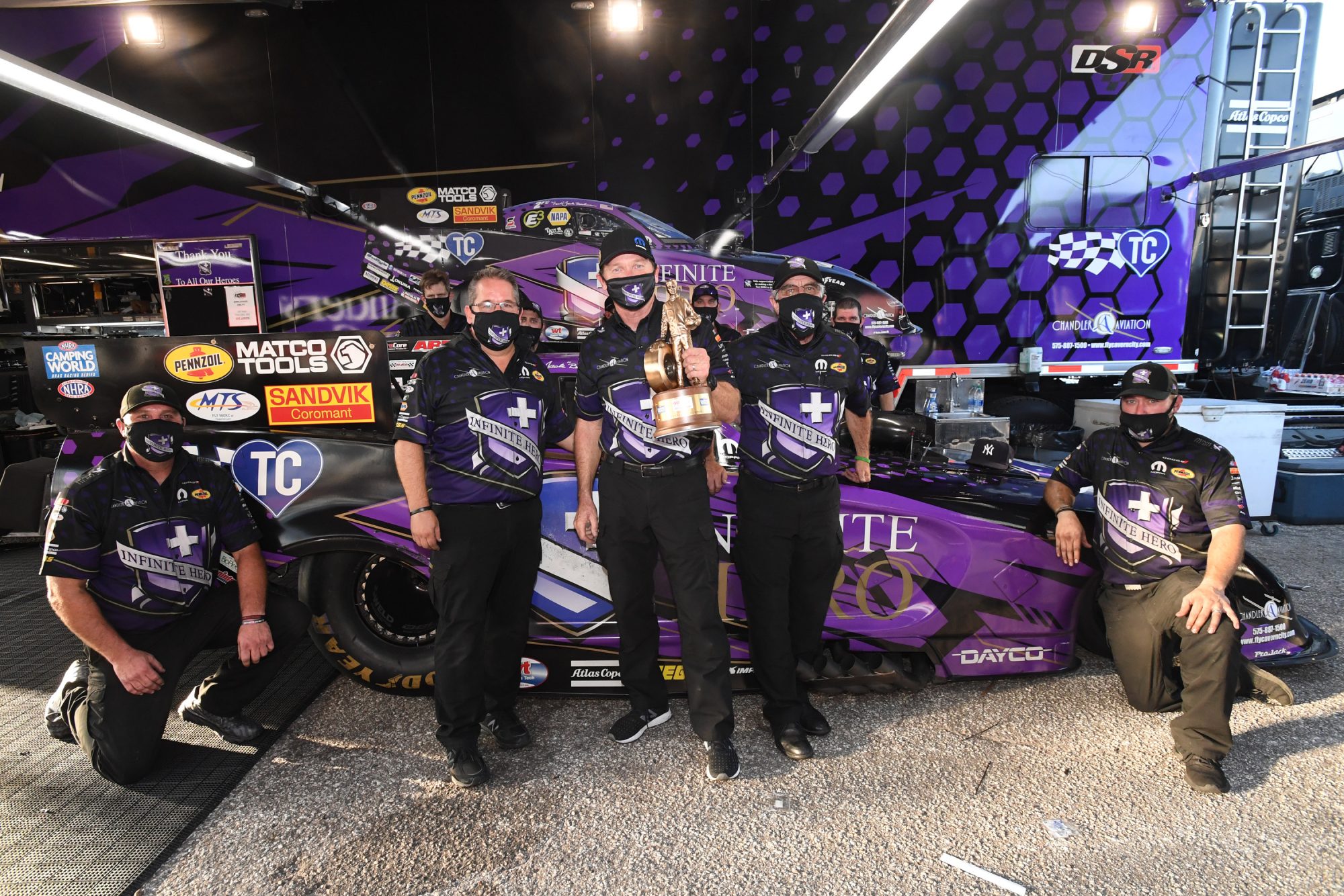 Jack Beckman and his crew holding up their trophy