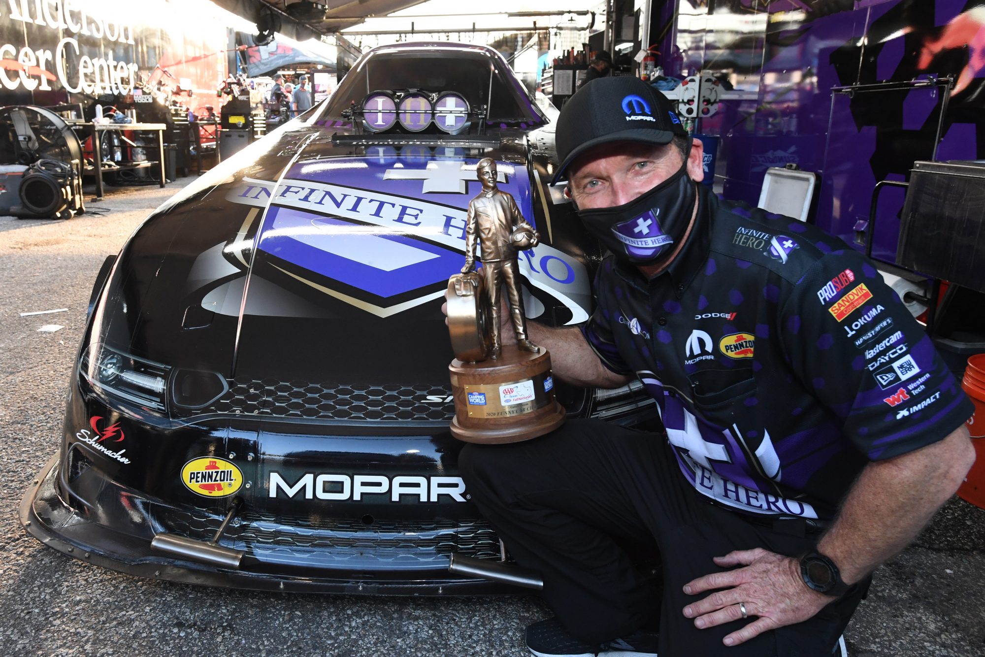 Jack Beckman holding his trophy