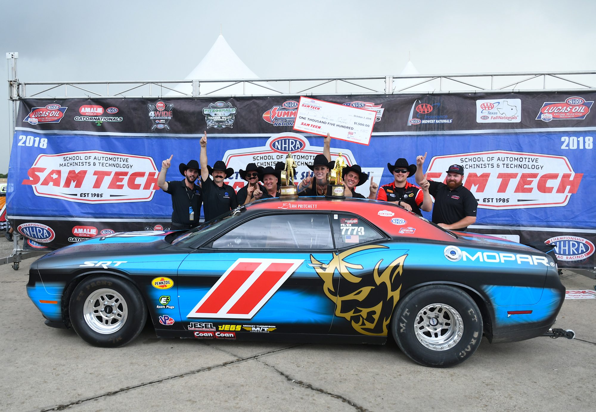 Leah Pruett & her crew with her Drag Pak