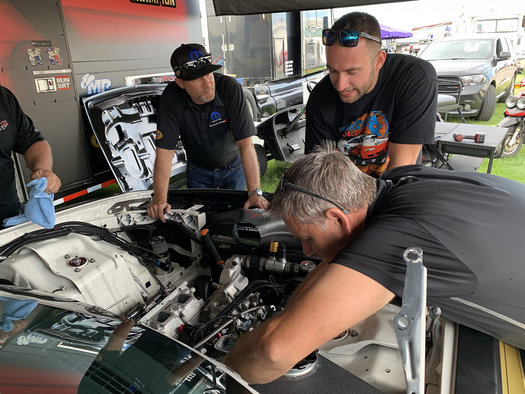 Kevin Helms working on a car