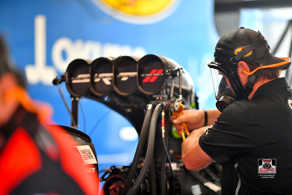 Neal Strausbaugh working on a top fuel dragster