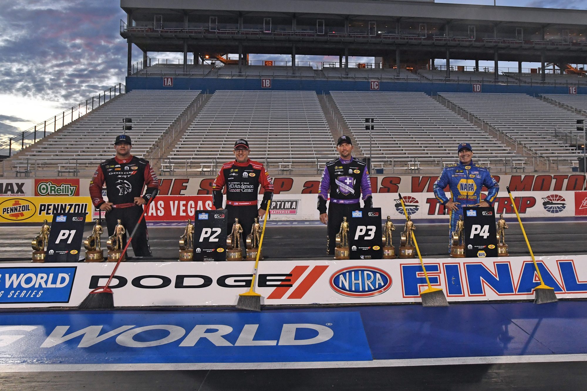 DSR drivers holding brooms representing a season sweep