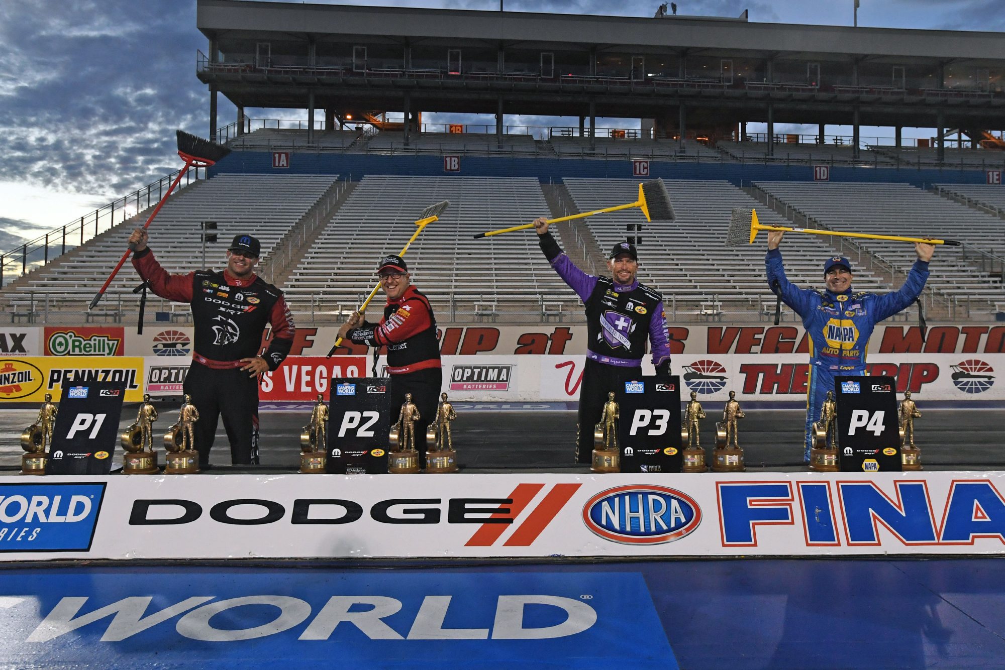 DSR drivers holding brooms representing a season sweep