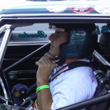 John strapping on helmet for racing