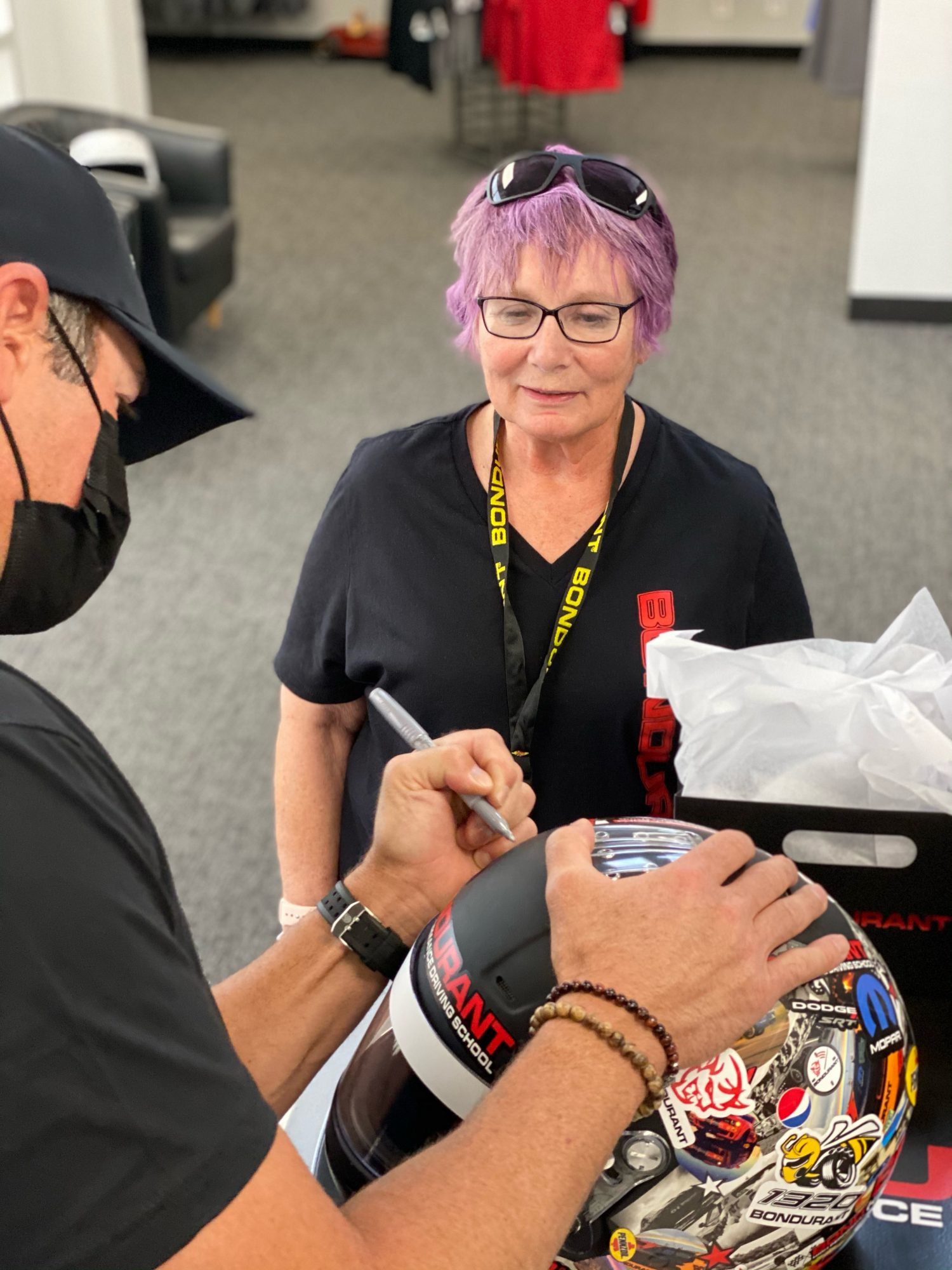 Chris Jacobs signing a helmet