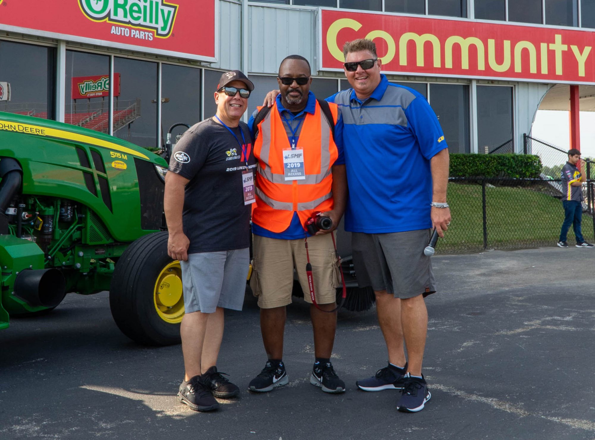 Anthony Carter posing with 2 men