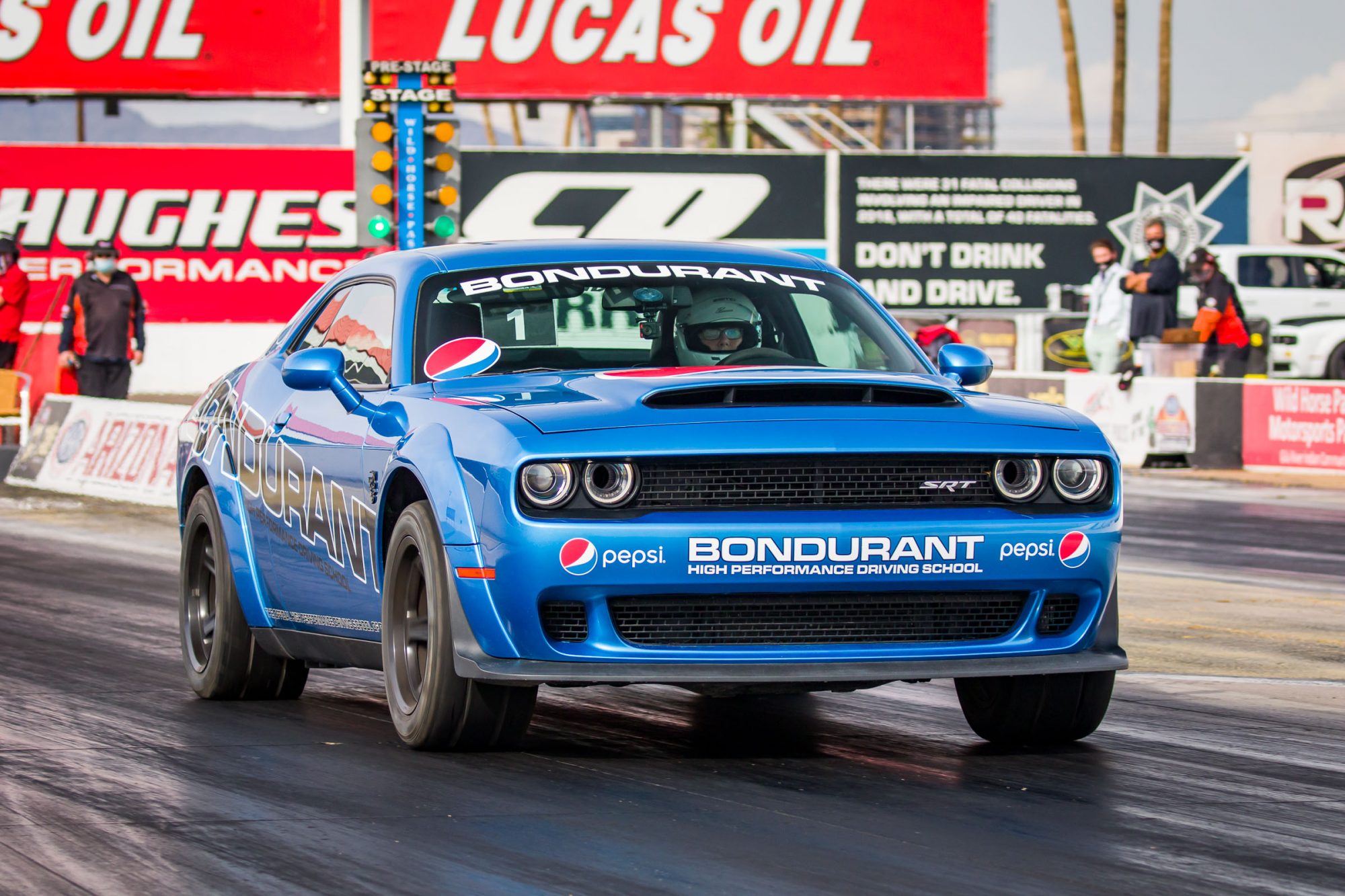 Carolyn driving at Bondurant