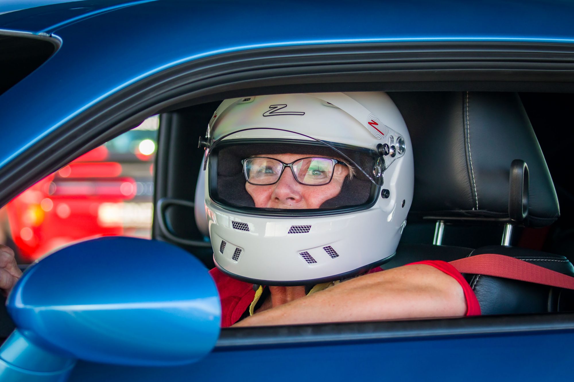 Carolyn driving at Bondurant