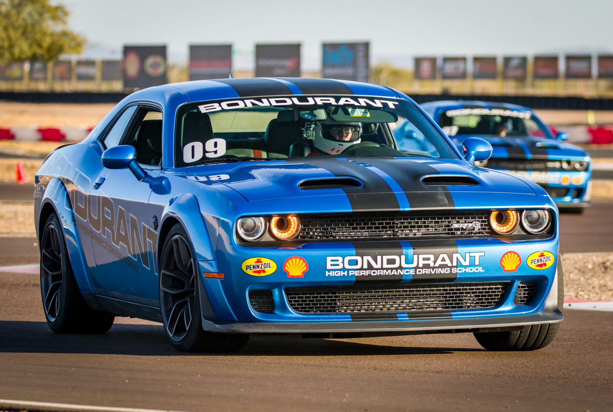 Carolyn driving at Bondurant