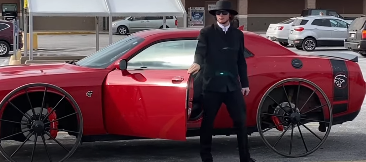 Man standing with a SRT Hellcat on buggy wheels