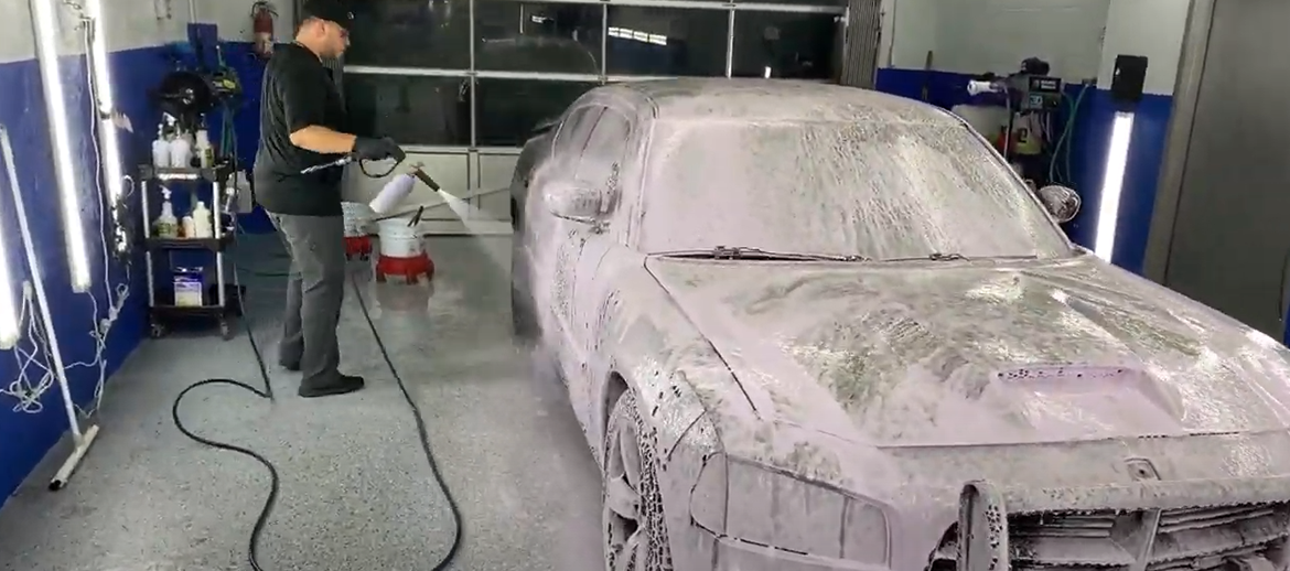 guy washing a car