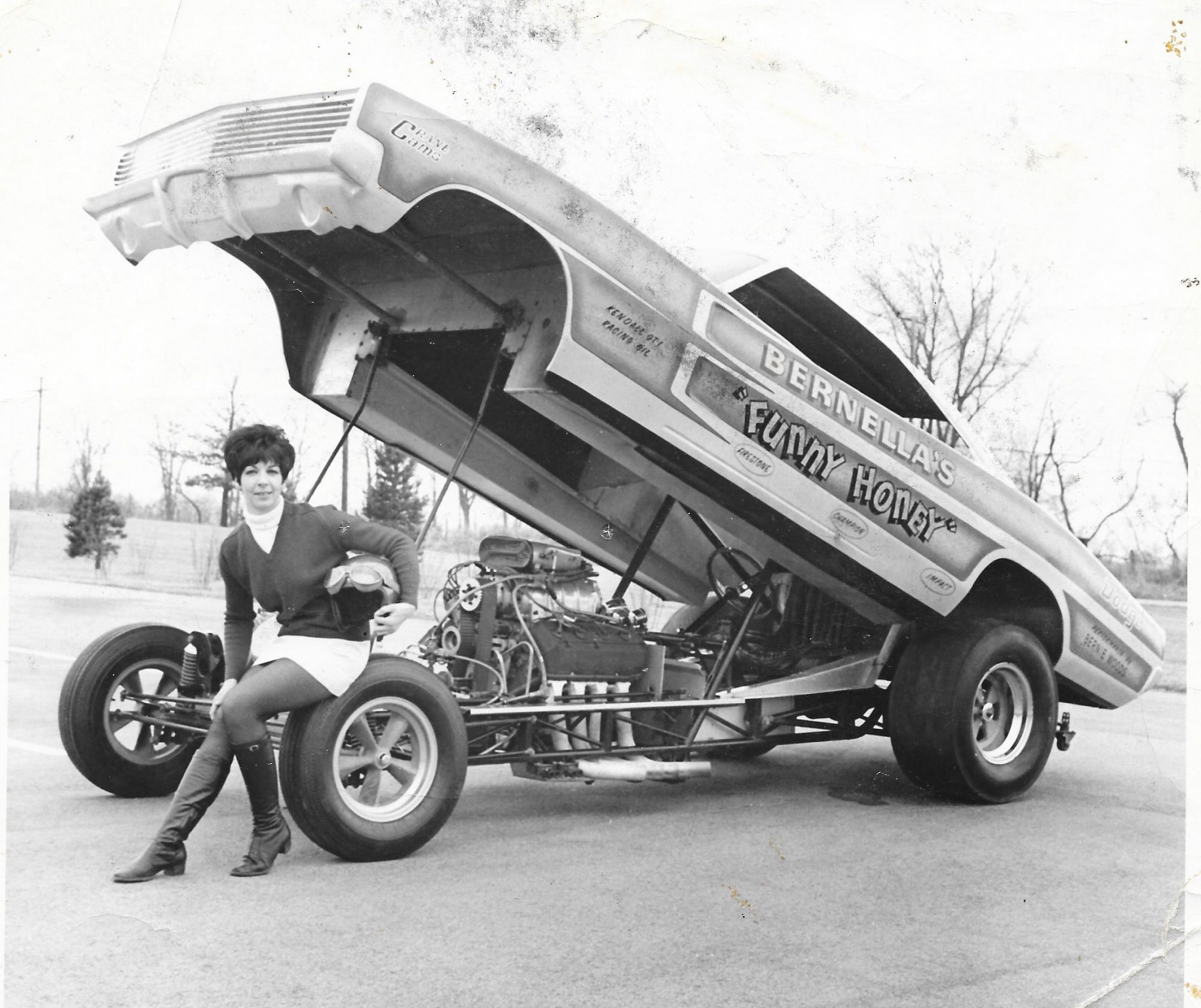 Della Woods posing with her Funny Car