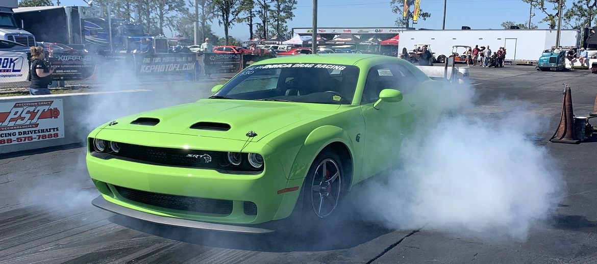 green challenger doing a burnout