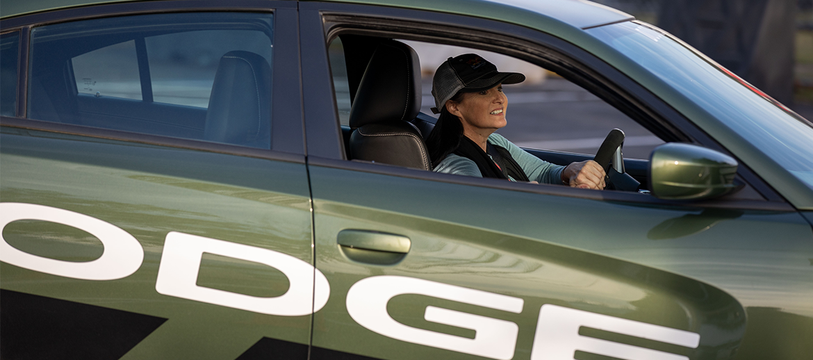 woman driving a Charger SRT Hellcat at a Power Party