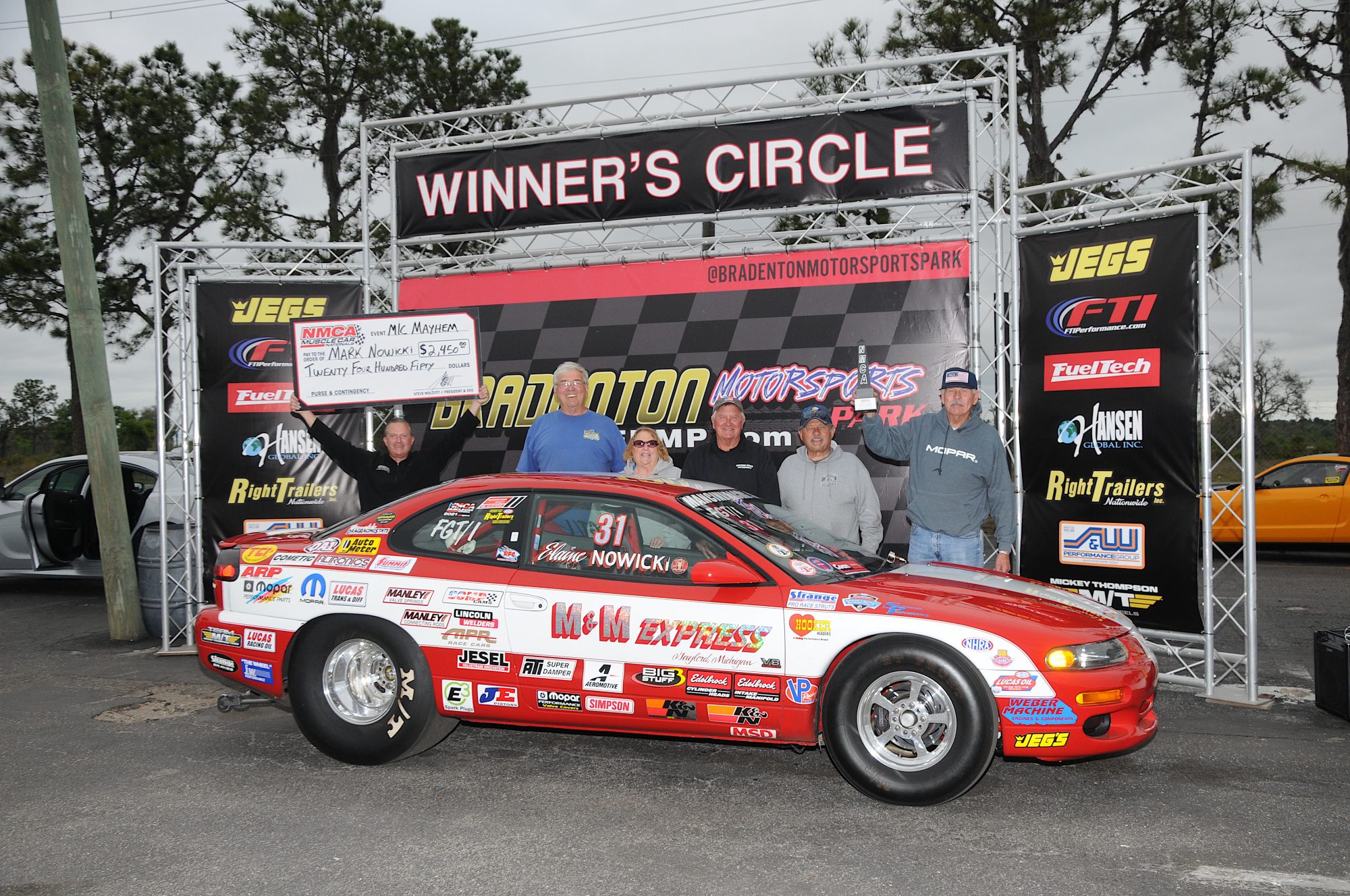 Mark Nowicki and his car in the winners circle