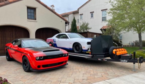 Dennis Chaisson's Drag Pak sitting on the trailer next to his SRT Demon