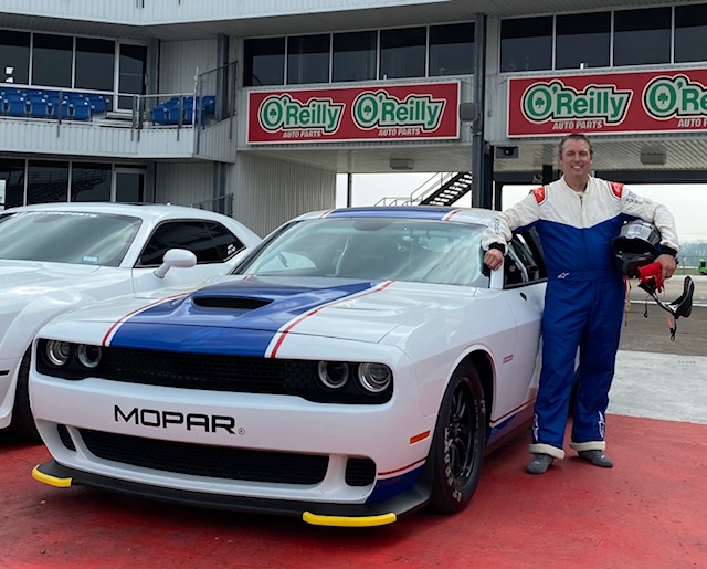 Dennis Chaisson standing next to his Drag Pak