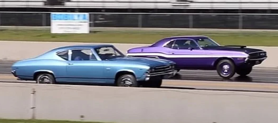 A 1970 Dodge Challenger R/T and a 1969 Chevrolet Chevelle drag racing