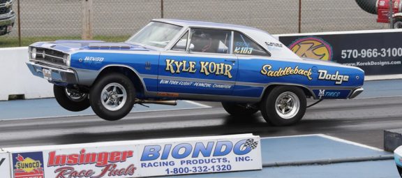 1968 Dodge Dart on two wheels on a drag strip