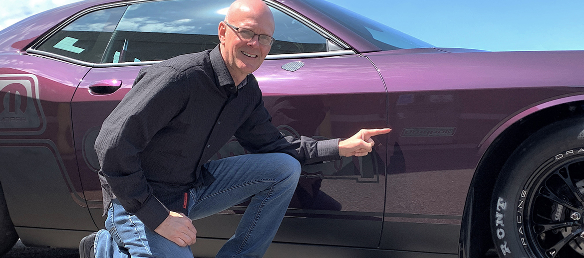 Man with his 2021 Dodge Challenger Mopar Drag Pak