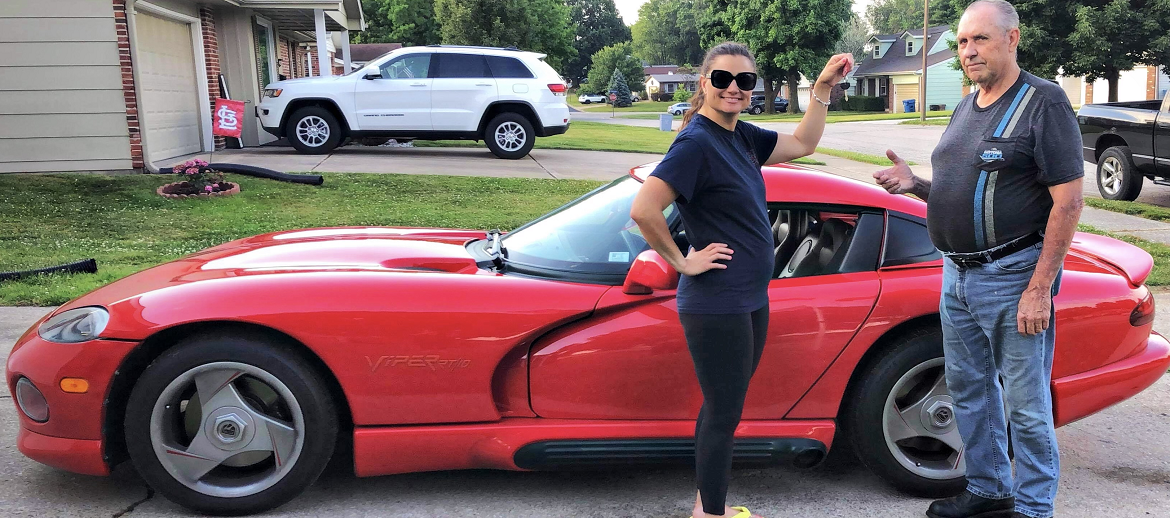 man and woman in front of a Viper